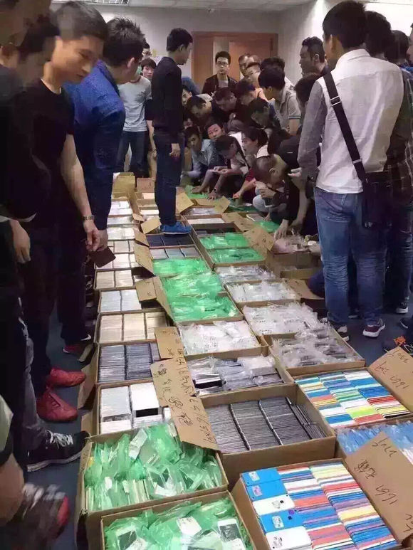 Different grades of refurbished iPhones are sold by cartons in Hongkong.